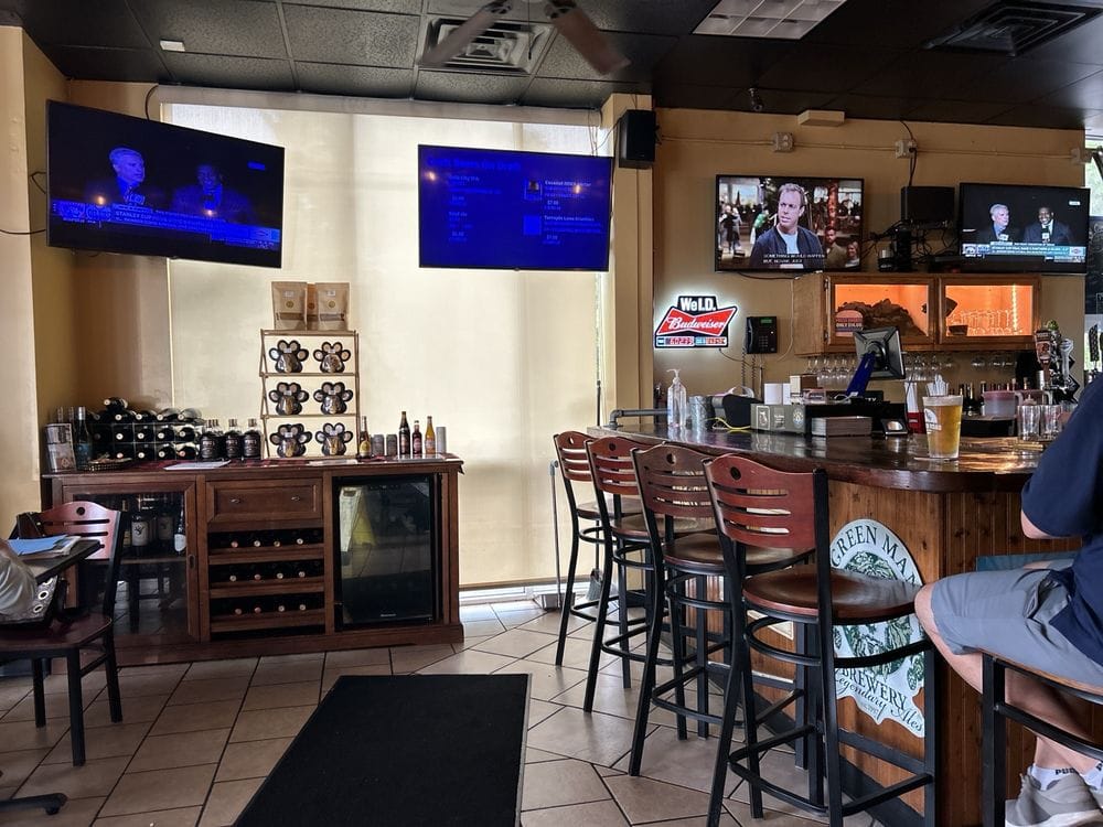 Craft beer taps, the wine cabinet and bar stools in the dining room at The Press